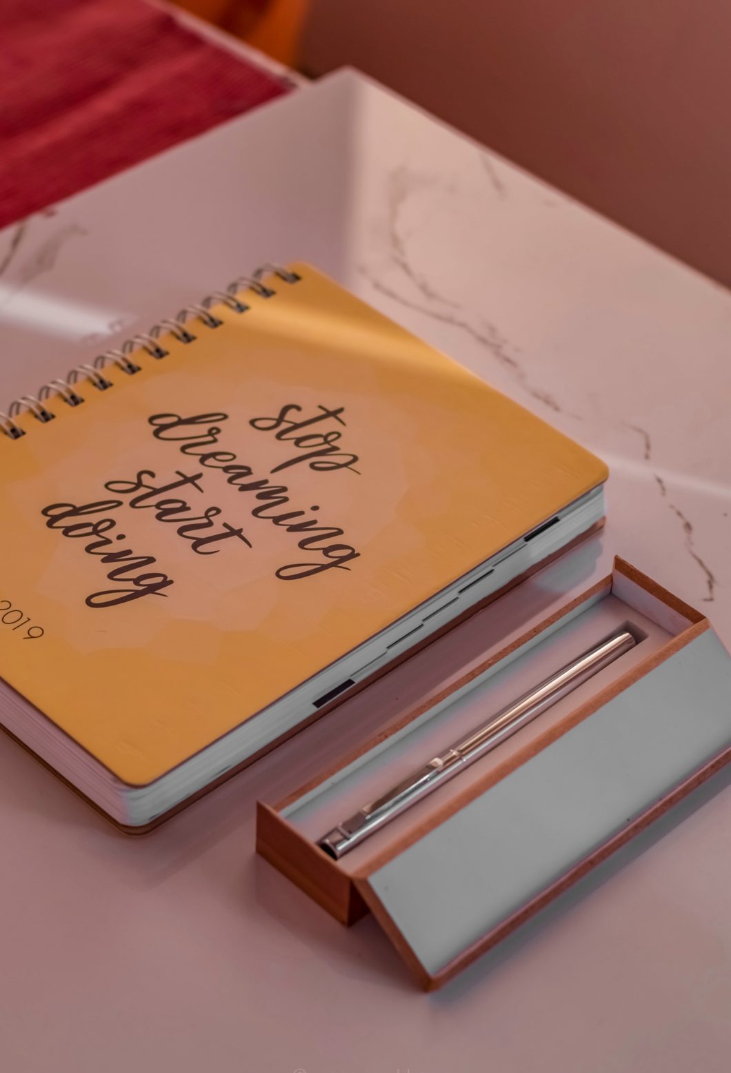 Journal and Pens on a desk