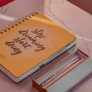 Journal and Pens on a desk