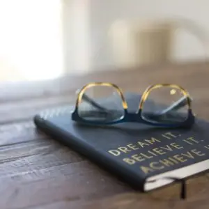 journal and glasses