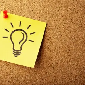 yellow sticky note with light bulb drawing