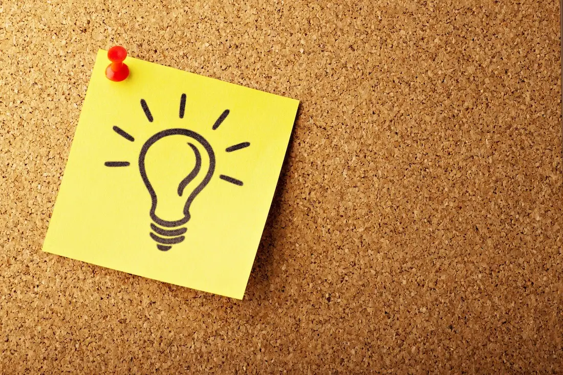 yellow sticky note with light bulb drawing